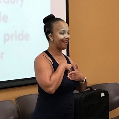 young woman smiles and shares with group