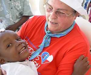 Wineva with one of the Deaf children